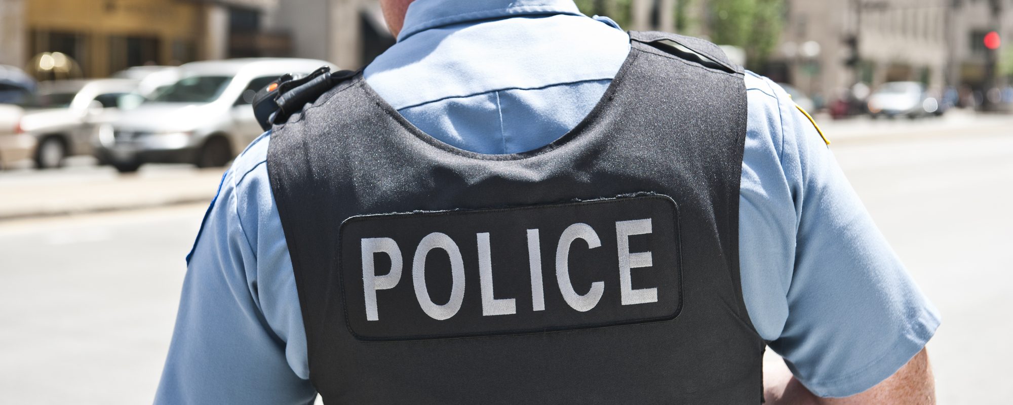 Kid fires distracted cop’s gun in crowded school hallway